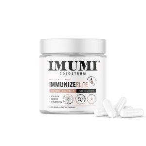 IMUMI Immunize Elite Colostrum Capsules—This is a Front view of the 180-capsule container with scattered capsules. The label showcases the product as an ancestral superfood with benefits to nourish, protect, and strengthen the immune system.